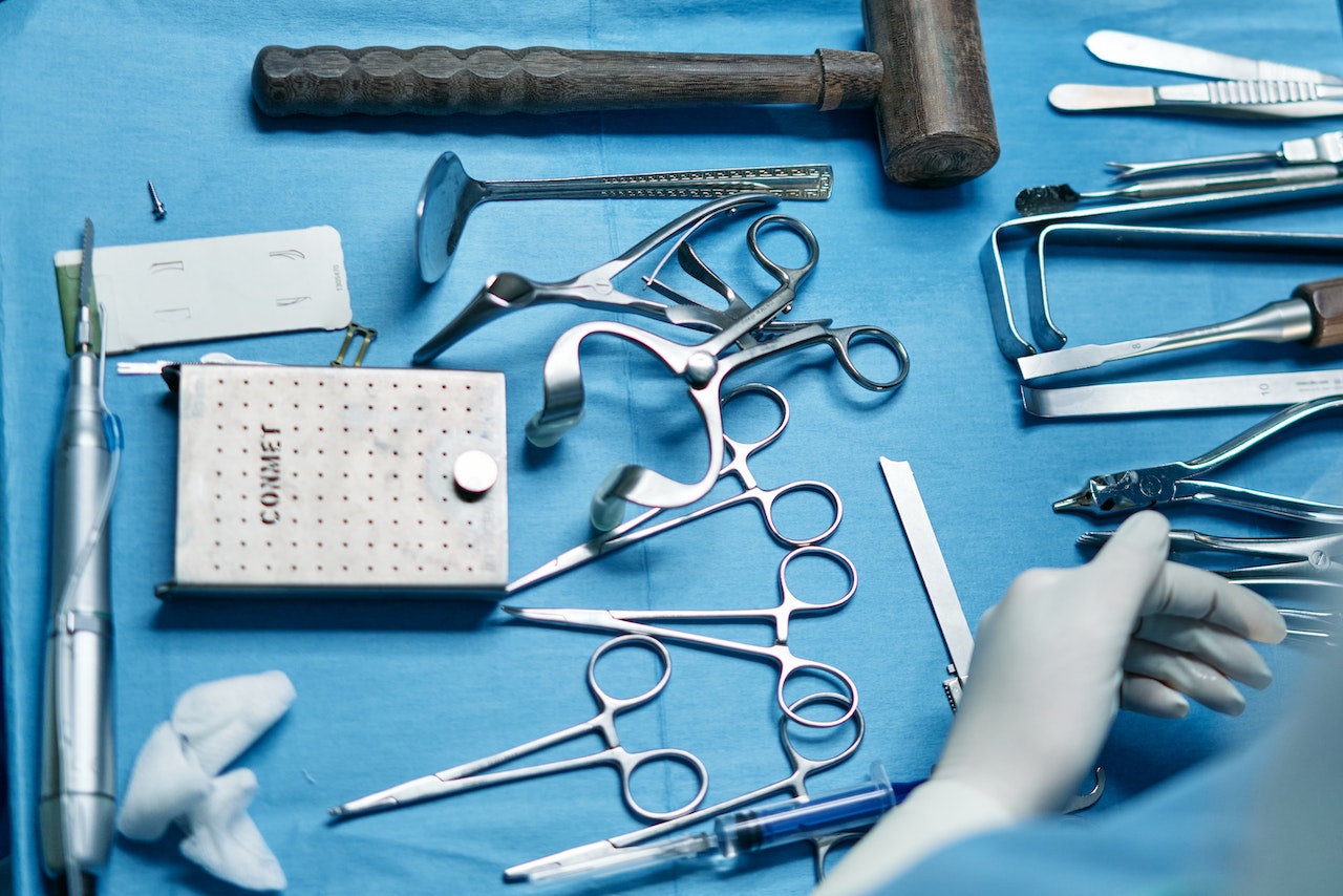 silver medical tools laid out on table
