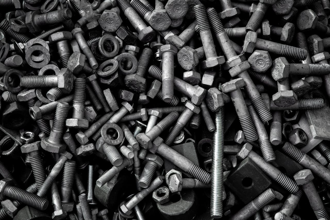 pile of dark gray metal screws