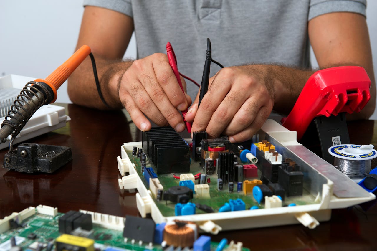 man working on circuit board