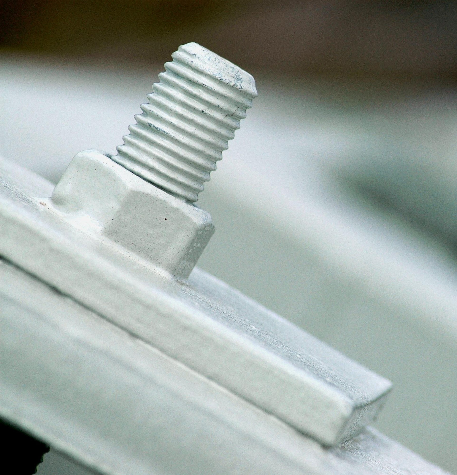 Powder coated bolt after phosphate coating applied.