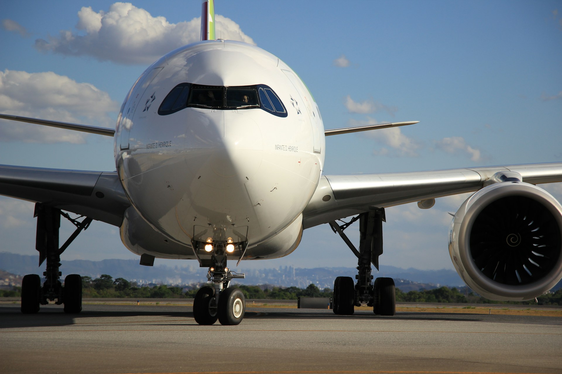 a white airplane is on the runway