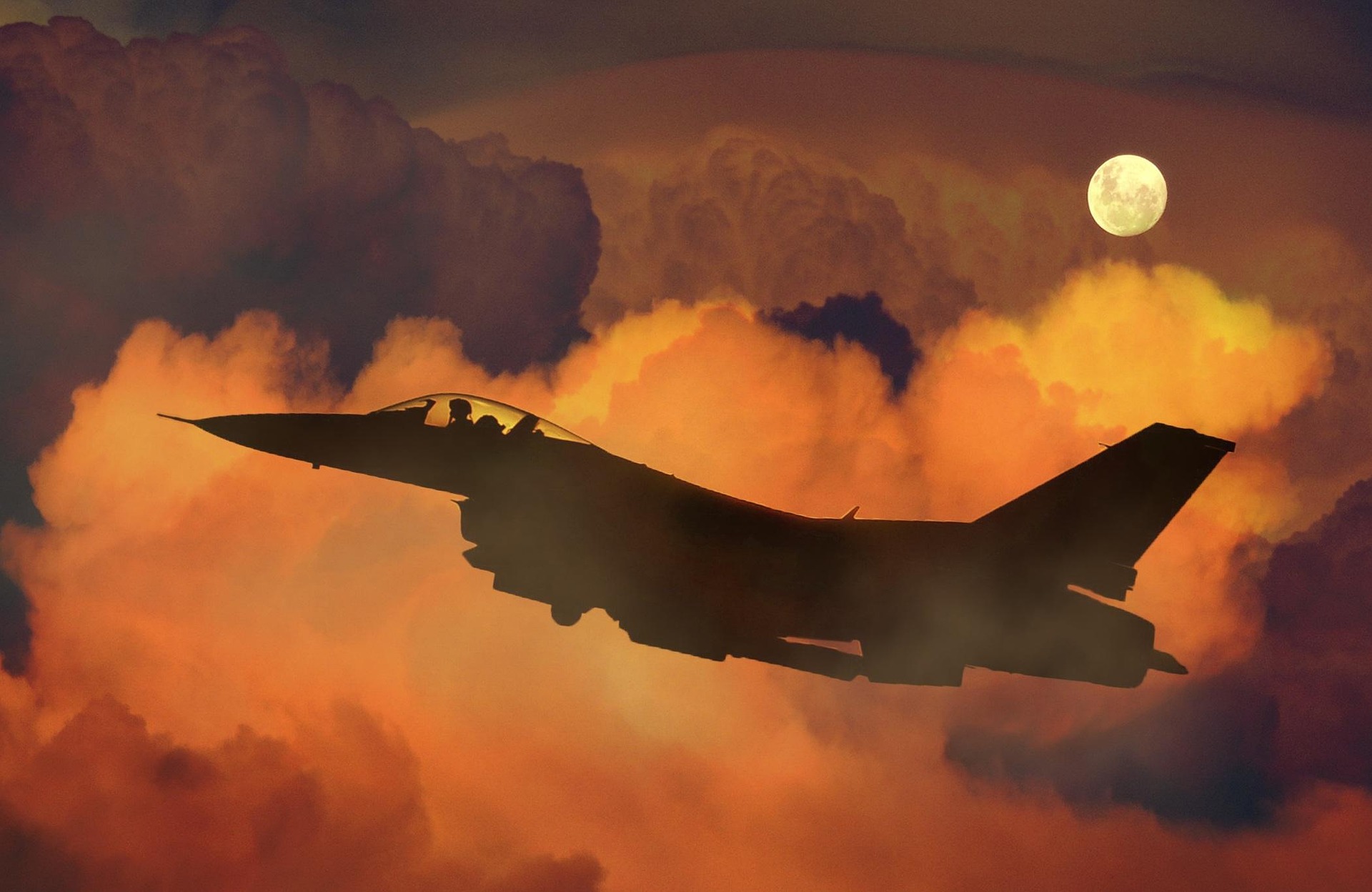 A fighter jet taking off through the clouds