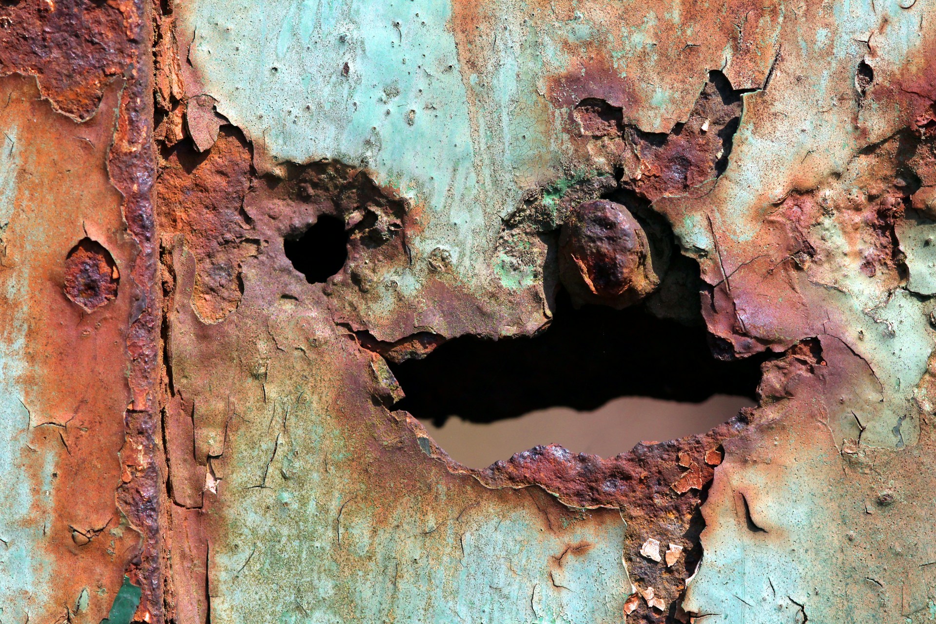 rust has set in the metal and created a hole along with coating peeling